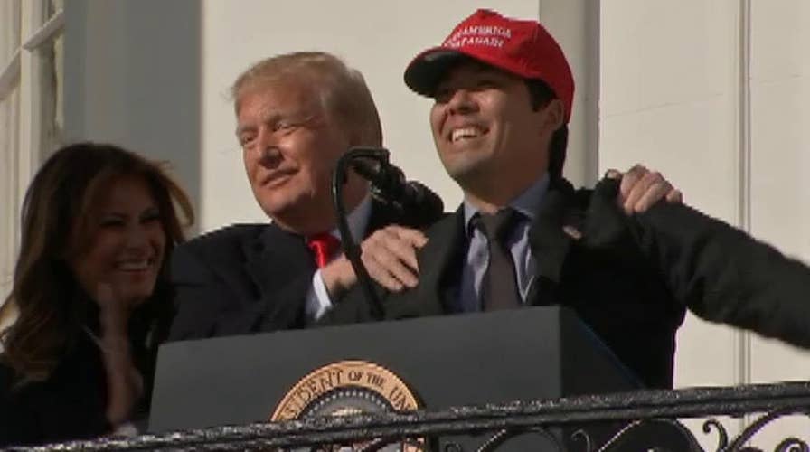 Trump hugs Washington Nationals' Kurt Suzuki, wearing 'MAGA' hat during  White House visit