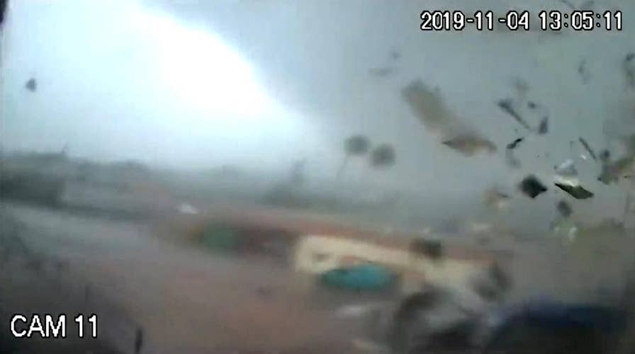 Surveillance cameras capture a tornado tear across a factory in Greece