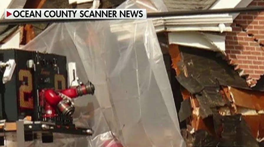 Two killed after red Porsche crashes into second floor of building