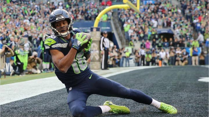 Seattle Seahawks' Tyler Lockett hospitalized after suffering 'severe' lower-leg injury