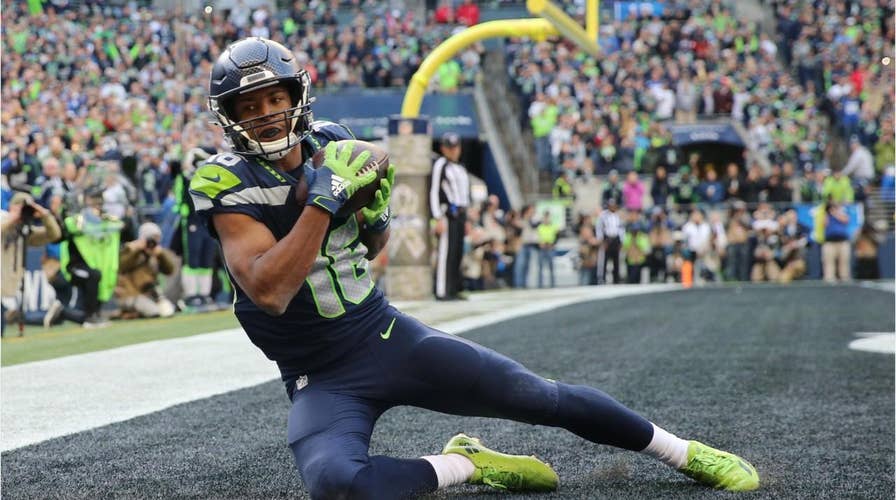 Seattle Seahawks' Tyler Lockett hospitalized after suffering 'severe' lower-leg injury