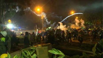 Hong Kong protesters clash with police in standoff at university