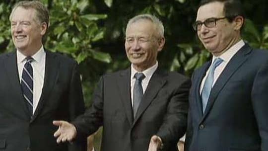 Report: US-China discuss phase-on trade deal