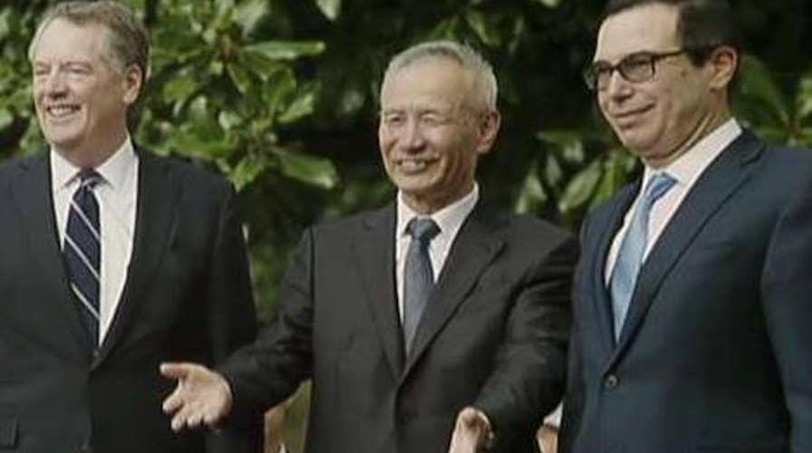 Report: US-China discuss phase-on trade deal