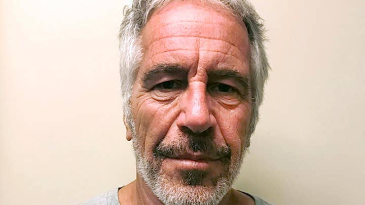 Two correctional officers charged with guarding Epstein charged