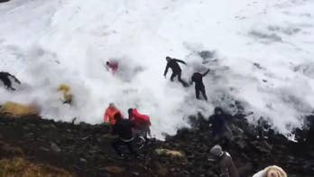 Wave catches tourist off guard at Iceland's iconic Reynisfjara Beach