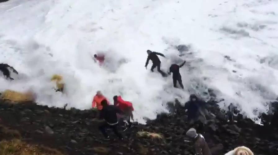 Wave catches tourist off guard at Iceland's iconic Reynisfjara Beach