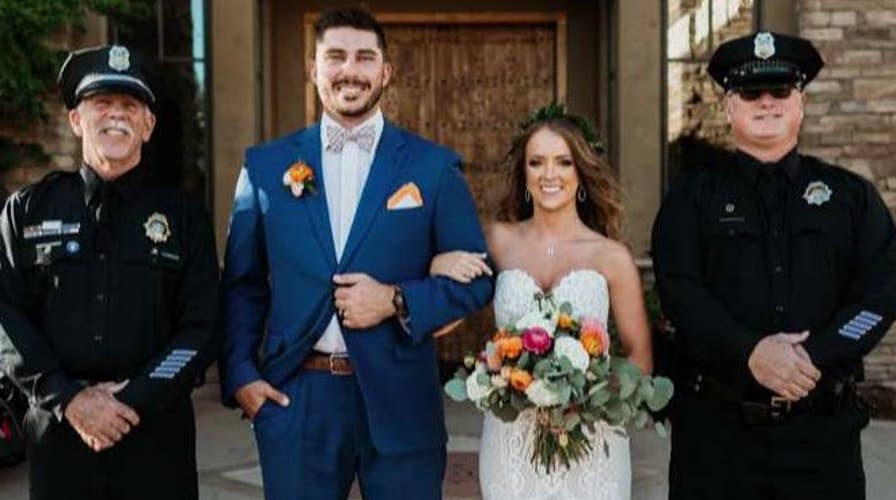 Police officers surprise daughter of fallen officer at her wedding