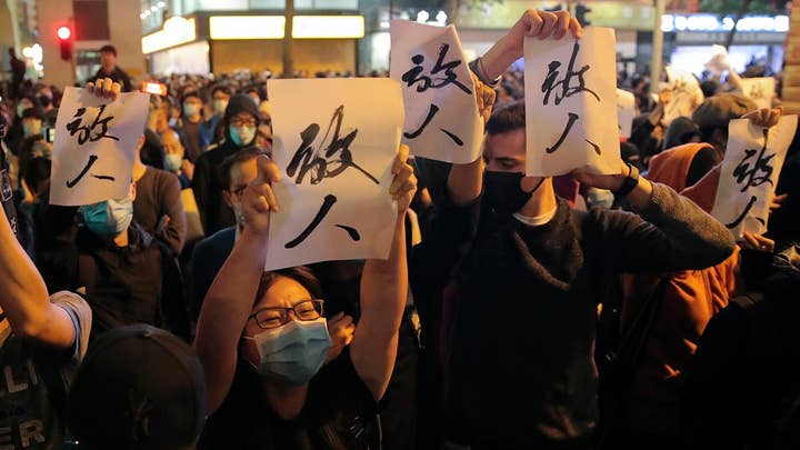 Pro-democracy candidates in Hong Kong claim landslide win at polls