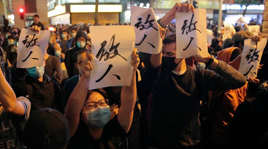 Pro-democracy candidates in Hong Kong claim landslide win at polls