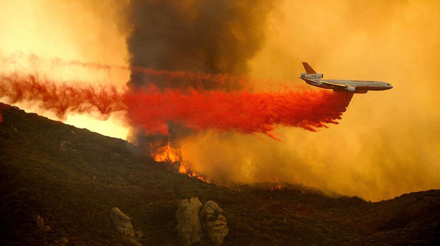 Crews battle wind-driven wildfire near Santa Barbara as flames race downhill toward homes