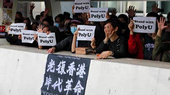 Hong Kong protesters praise Trump, Congress for law; Beijing calls move sinister