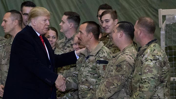 Trump says US will resume peace talks with Taliban during surprise Afghanistan visit