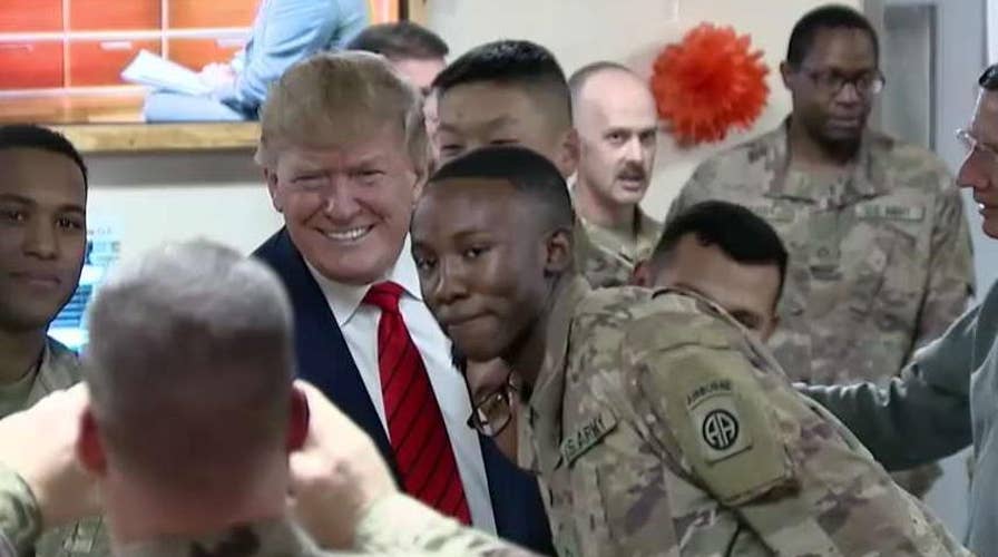 President Trump's visit to Afghanistan raises hopes for elusive deal to end 18-year war