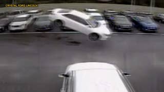 Watch: Toyota Camry launches 139 feet into the air, over two rows of vehicles before landing in parking lot - Fox News