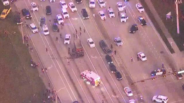 Raw video: Massive police chase concludes as dozens of officers surround UPS truck stolen by robbery suspects	