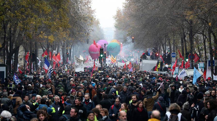 Pension protesters in Paris disrupt transit, close schools and Eiffel Tower