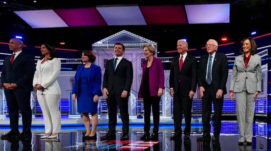 Cory Booker unhappy with DNC debate rules; Joe Biden spars with caucus goer