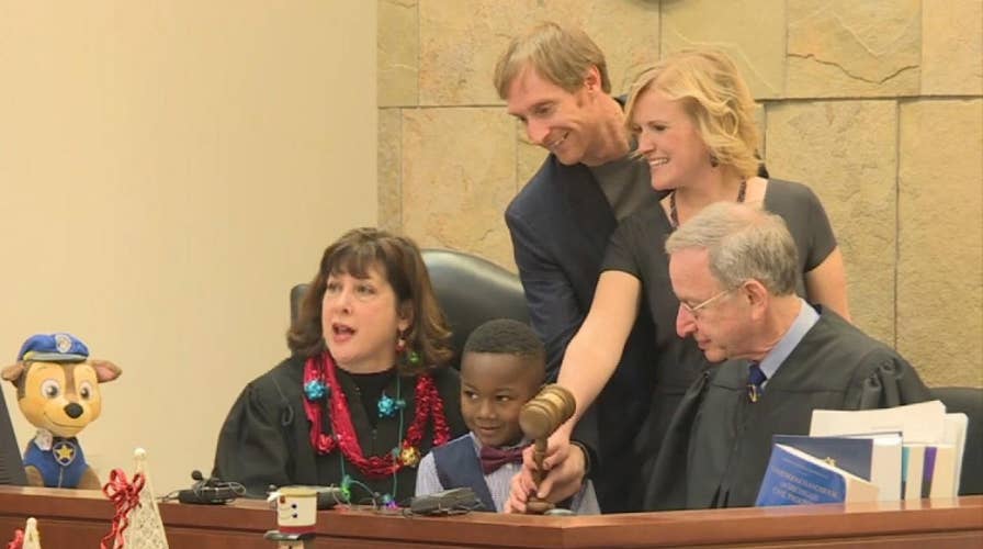 Young boy invites his kindergarten class to his adoption