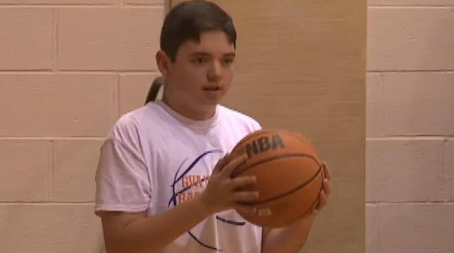 Crowd goes wild as autistic teen sinks 3-pointer
