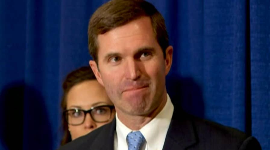 Kentucky Governor Andy Beshear speaks before signing executive order restoring voting rights to some felons