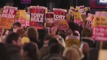 Conservative election landslide sparks protests in UK