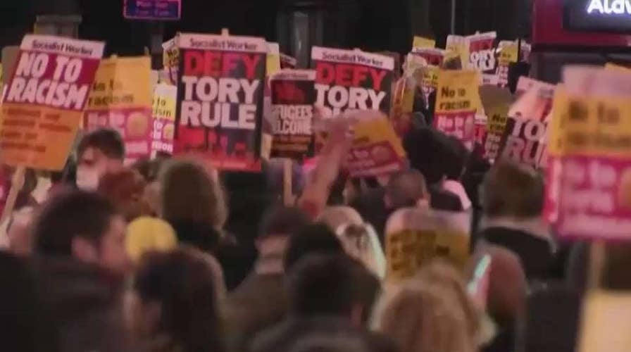 Conservative election landslide sparks protests in UK