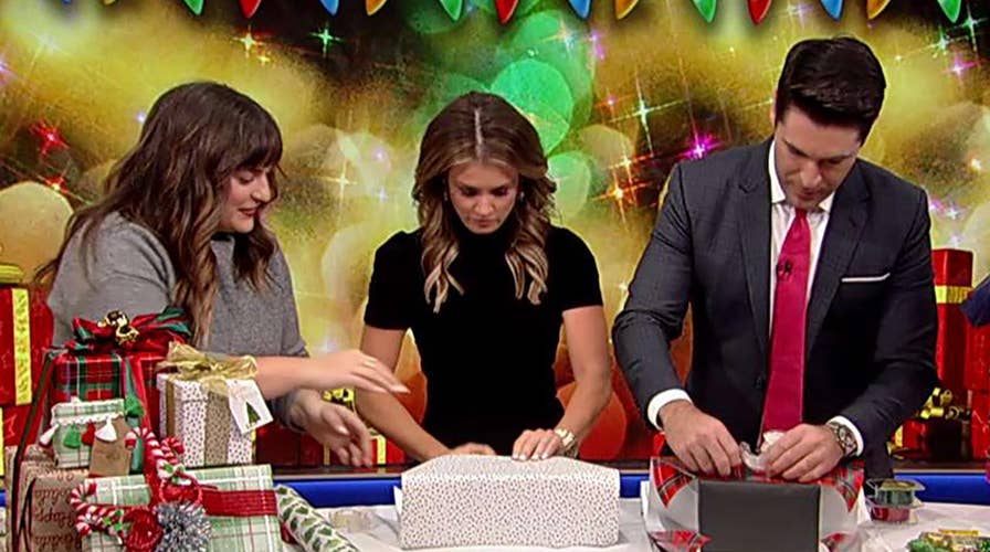 Rob Schmitt and Jillian Mele compete in a holiday wrap battle