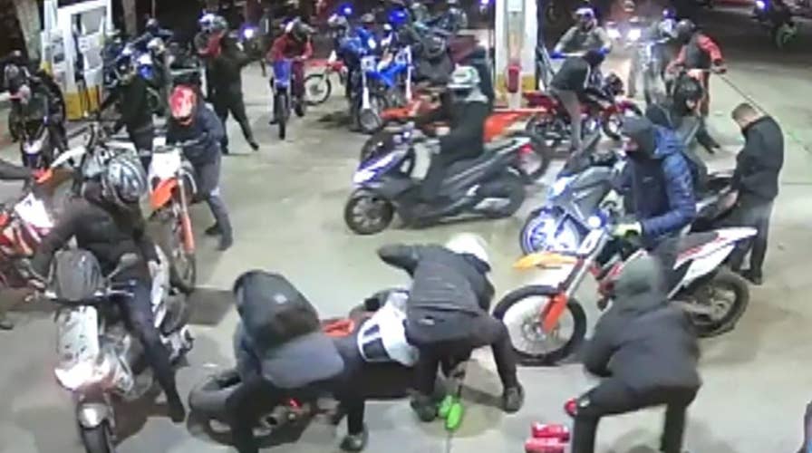 Armed men with knives, sword overrun, rob English gas station