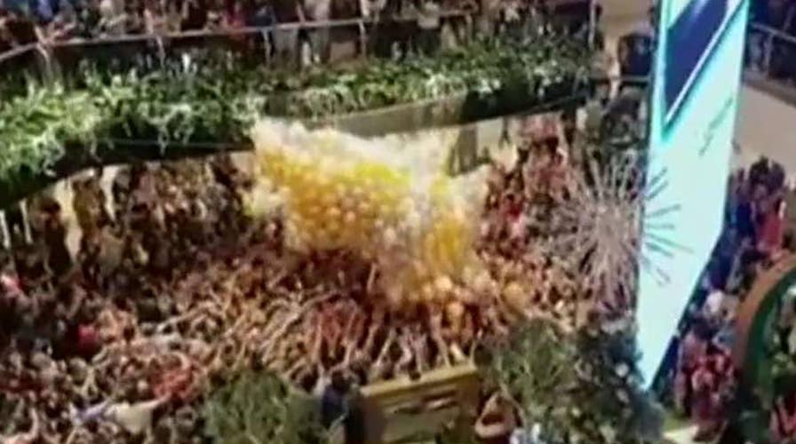 Balloon drop causes dangerous stampede in Sydney mall