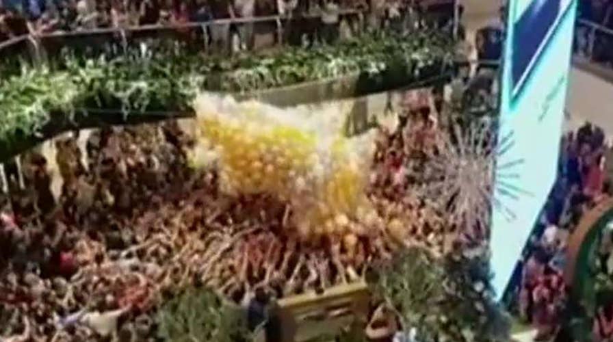 Balloon drop causes dangerous stampede in Sydney mall