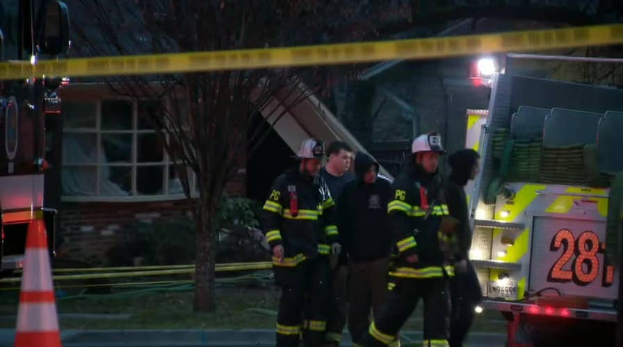 Raw video: First responders cordon off Maryland home that was struck by small plane