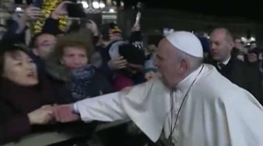 Pope apologizes for smacking hand of woman who grabbed him