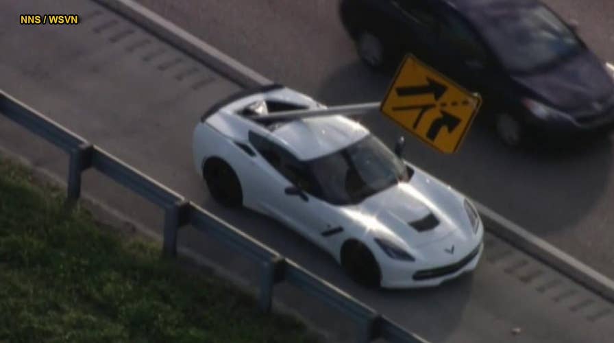 Flying highway sign impales Chevrolet Corvette in Florida