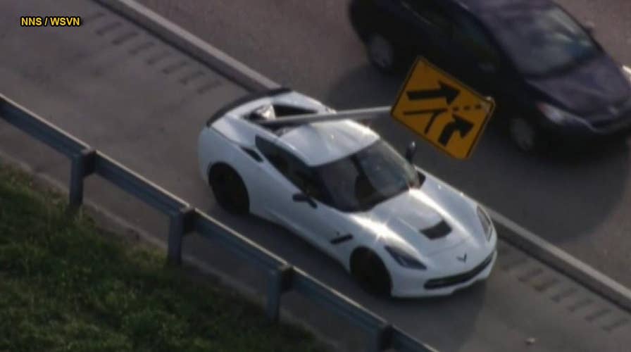 Flying highway sign impales Chevrolet Corvette in Florida