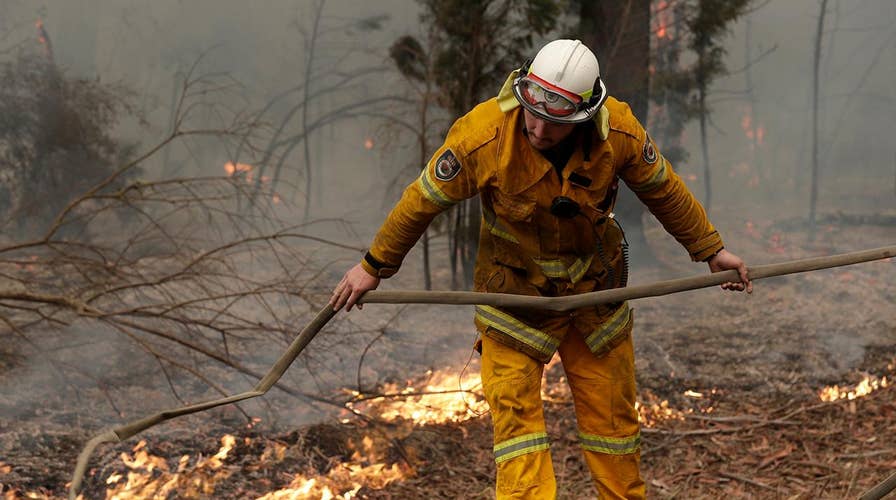 Firefighters in Australia fear warmer temperatures will reignite contained fires