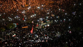 Iranians mourn Soleimani's death as Tehran says it will no longer abide by limits set by 2015 nuclear accord