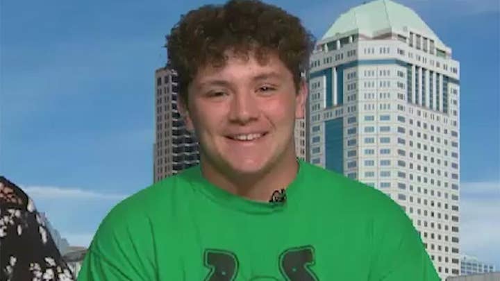 High school hero lifts car to save neighbor's life