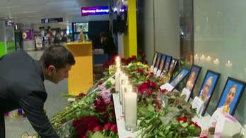 Mourners gather to pay tribute to passengers killed when Ukrainian passenger jet was shot down by Iran
