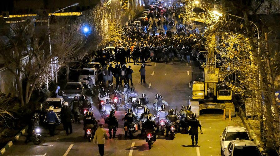 Iran appears to use live ammunition on protesting crowds