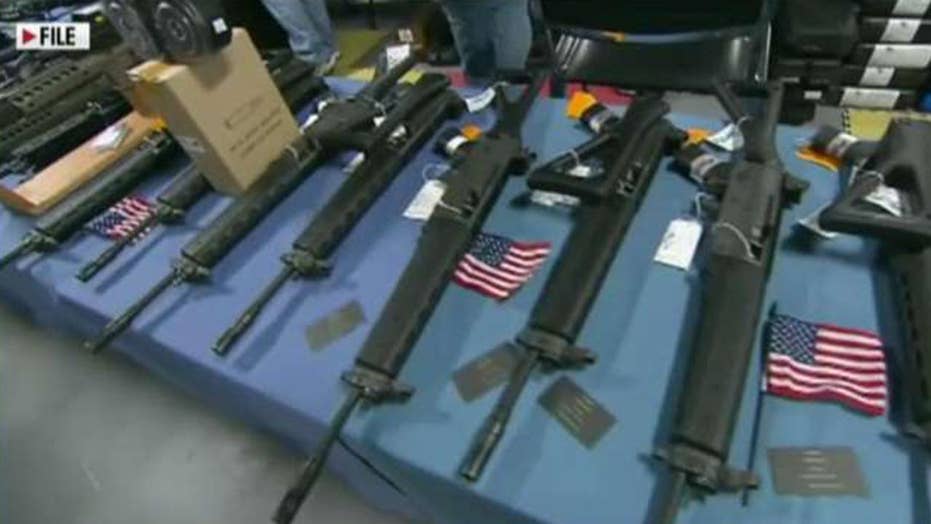 ar 15 style rifle to council meeting