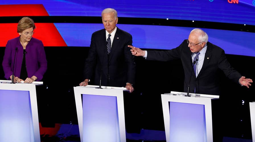 Hot mic captures tense exchange between Warren and Sanders