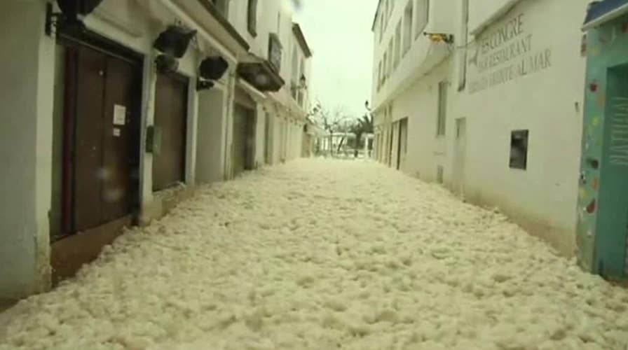 Sea foam floods streets of Spanish town during a deadly storm