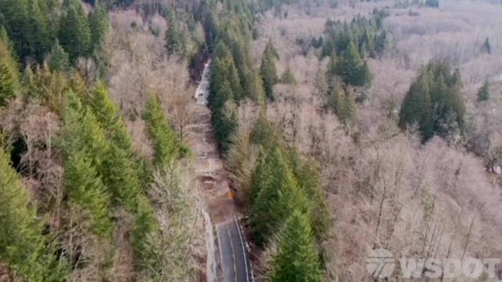 Convoy helps evacuated residents return home near Mt. Rainier after landslides blocked main roads