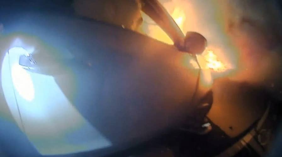 California police officer saves driver from burning car