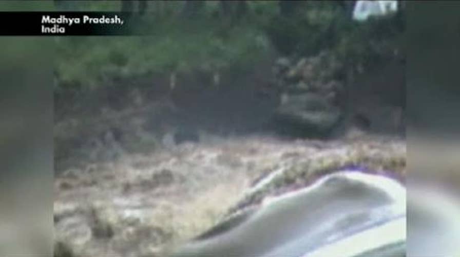 Caught on Tape: Boy Rescued from Floodwaters