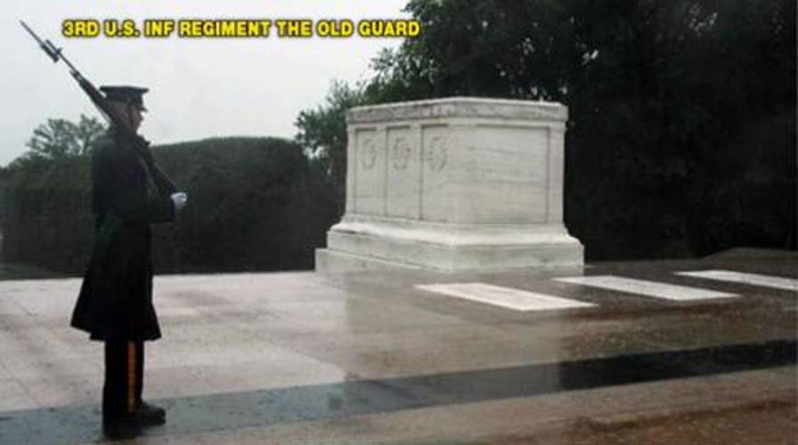 Troop Stands Guard Over Tomb of Unknown Soldier in Arlington National Cemetery During Hurricane Irene