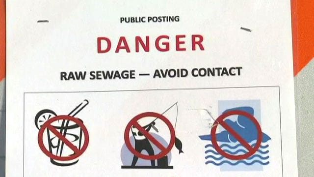 Raw sewage pours out onto beach