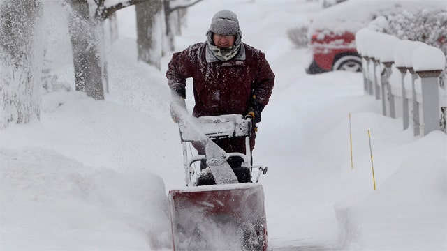 White House issues climate change rules amid wintry blast