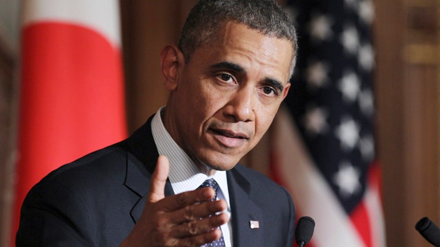 Obama warns of sanctions as Russia threatens Kiev